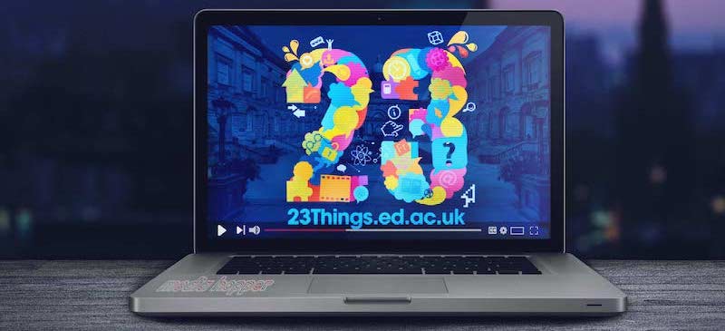 laptop with 23 Things logo background