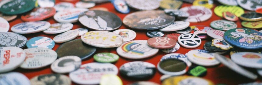Photograph of a pile of button badges