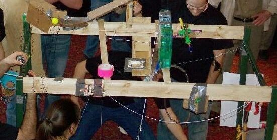 Students working on a rube goldberg machine