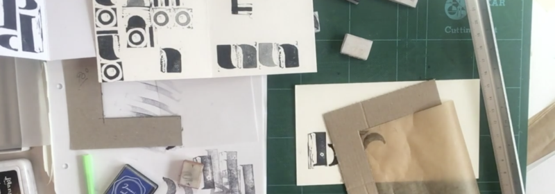 assortment of stamps, inks, and papers