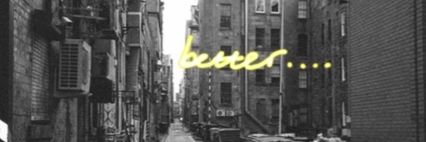 back street with bins and the floating word better