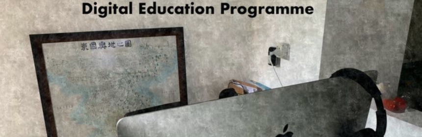 Headphones hanging on a desktop monitor