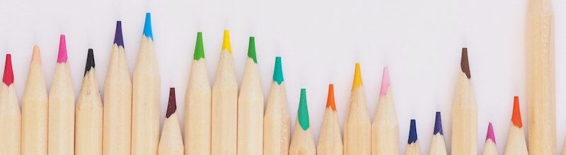 different coloured pencils in a line