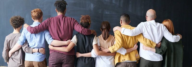 students facing blackboard